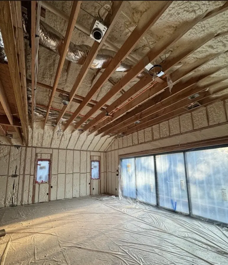 Interior walls and ceiling insulated with spray foam during new construction in Great Barrington